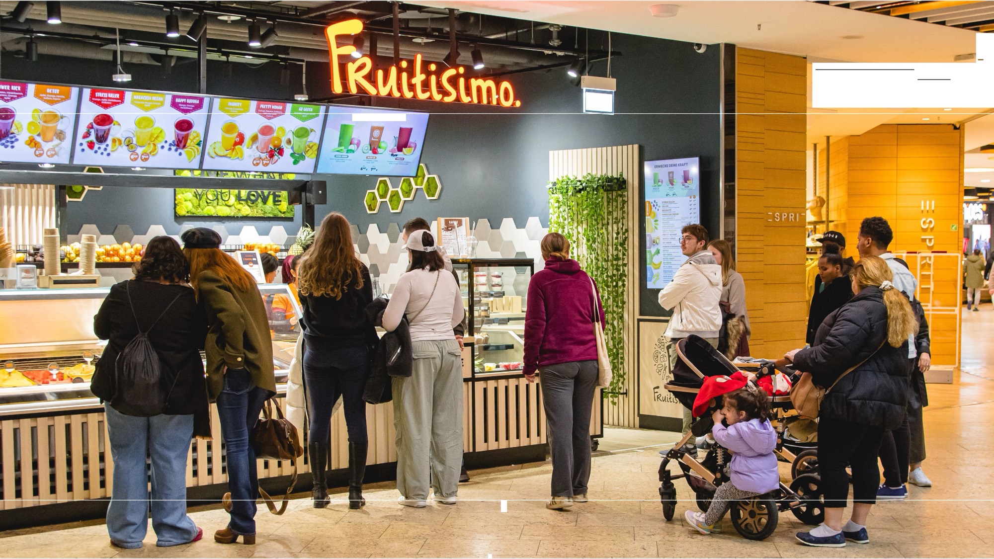 Customers at a busy Fruitisimo shop